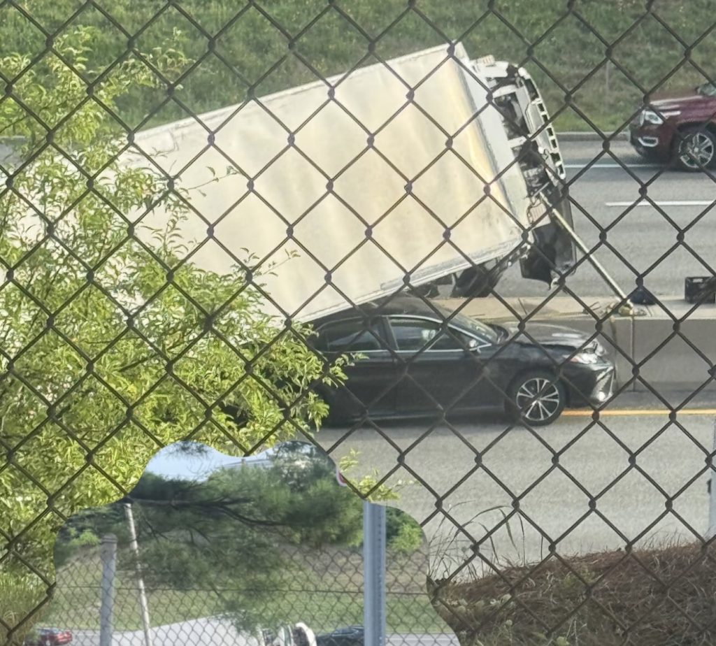 Box truck lands on car